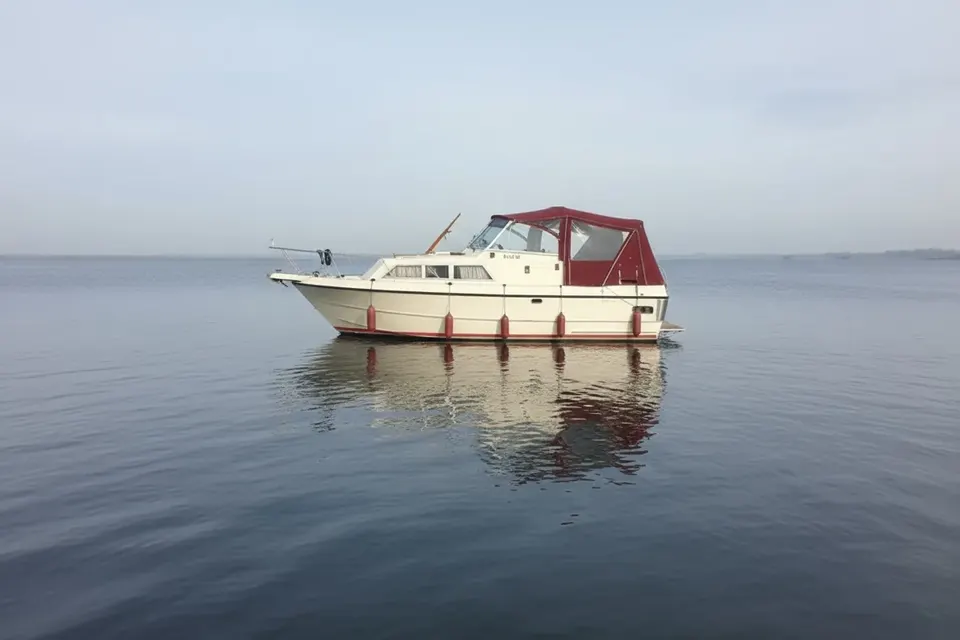 A completed red boat hood with clear panels for /marine-canvas